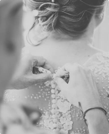 A beautiful bride holding a bouquet of white roses