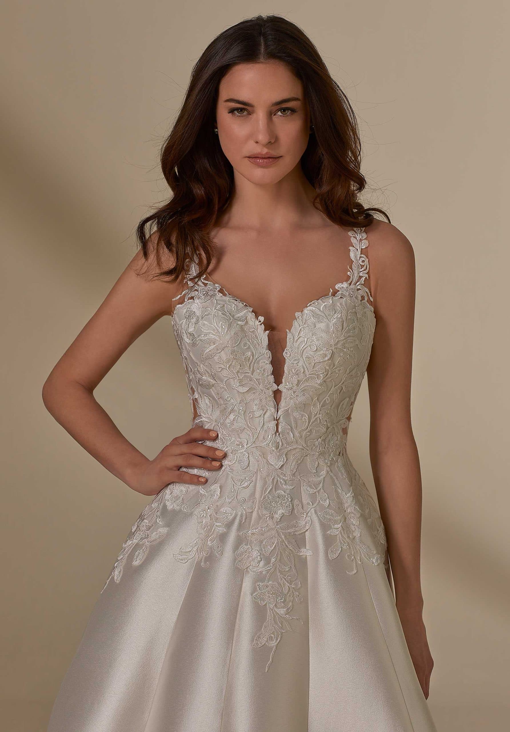 Close-up of Justin Alexander Moira 4133 wedding dress lace bodice with floral appliqué and plunging neckline