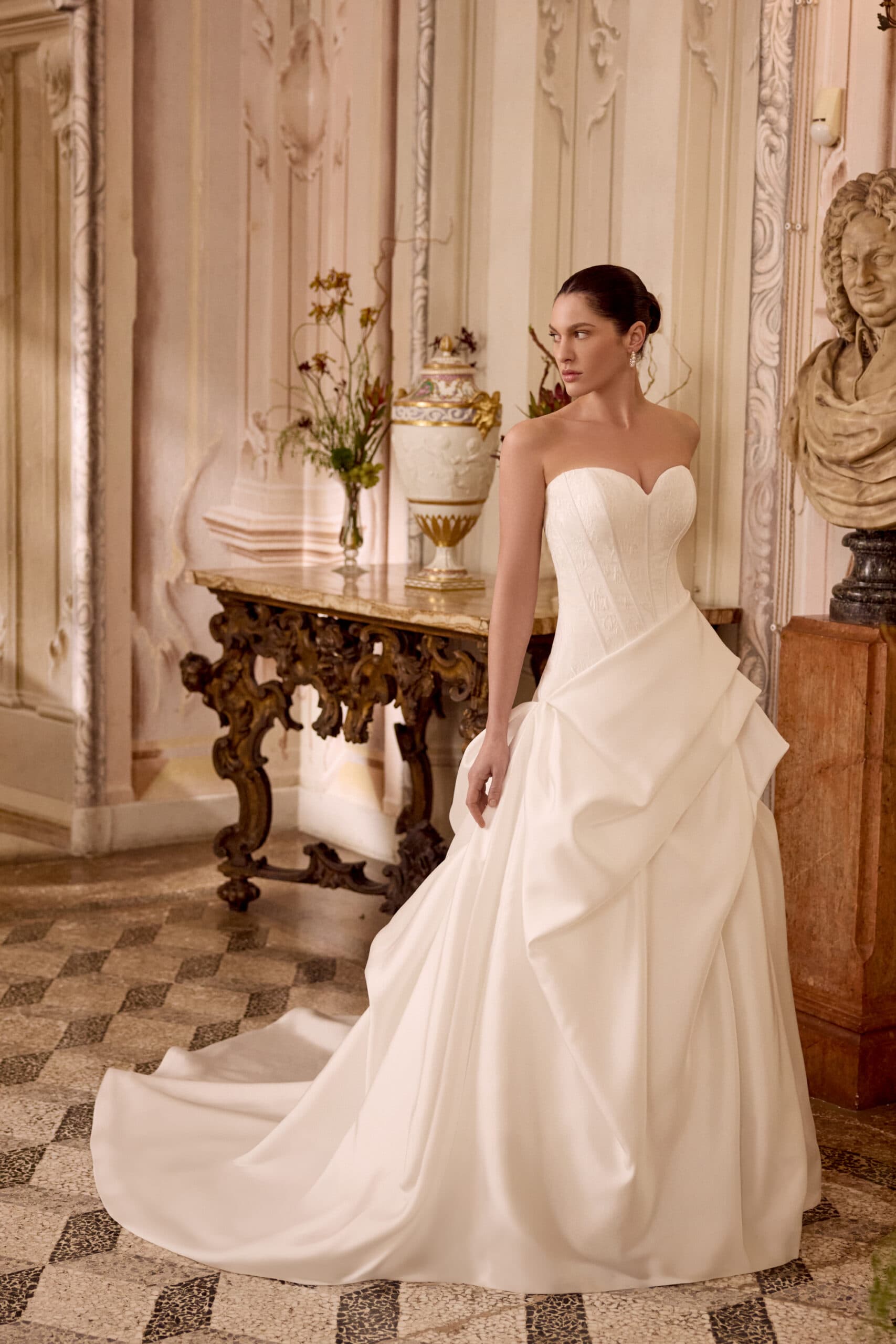 Leizel 88494 - Justin Alexander wedding dress by Justin Alexander - Features a brocade bodice with exposed boning that lea...