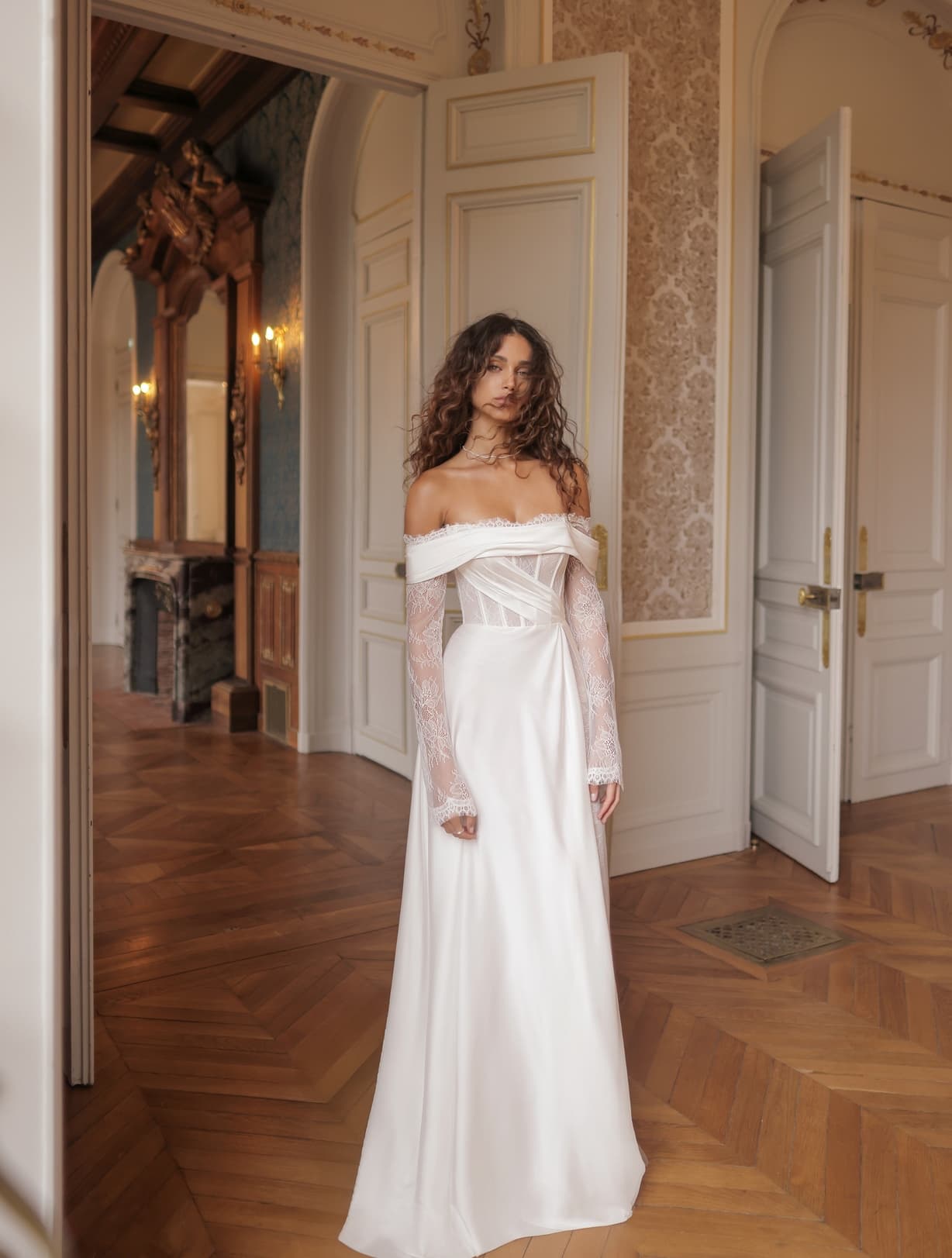 Murray - Wona wedding dress by Wona Concept Flowing off-the-shoulder gown with corseted bodice and delic... view 1