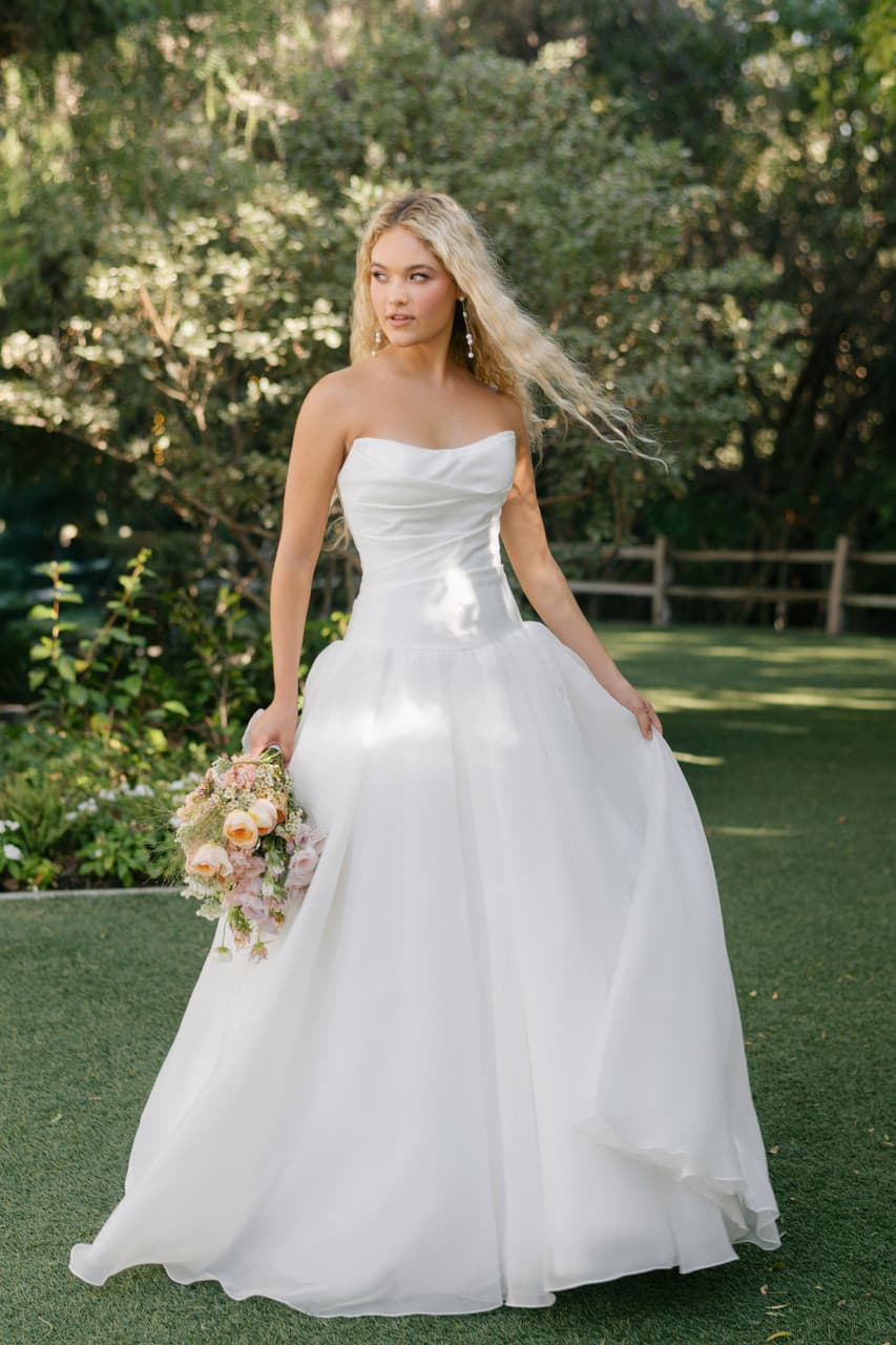 Strapless A-line wedding dress with structured bodice and full flowing skirt front view